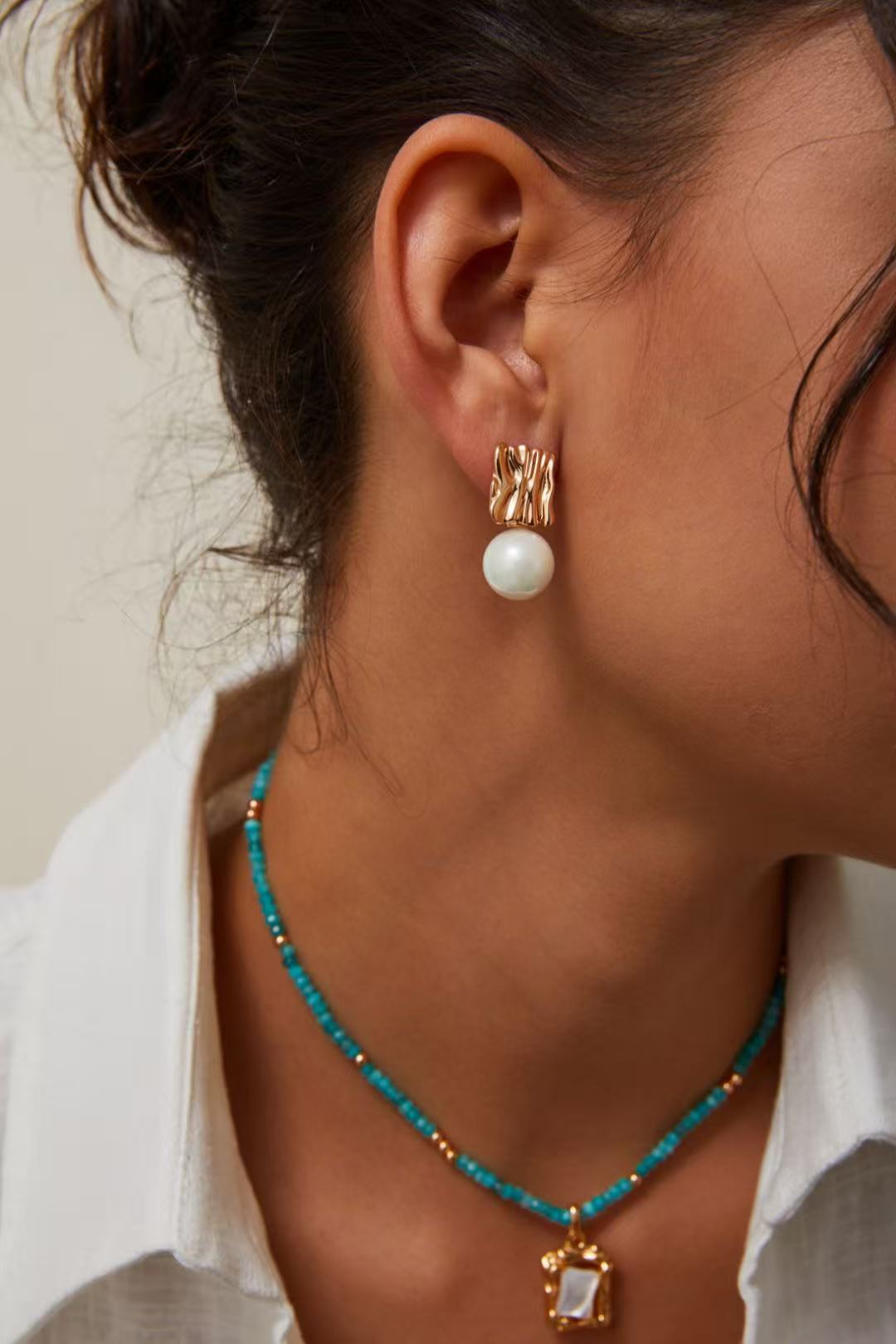 gold sculpted metal freshwater pearl earrings